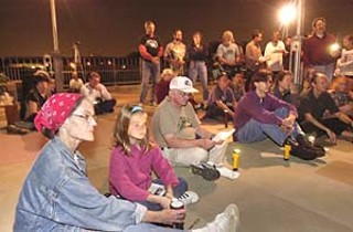 Peace activists observed Veterans Day Tuesday with a candlelight vigil on the Lamar Street Pedestrian Bridge. The ceremony, sponsored by Austin Veterans for Peace and Peace Action Texas, mourned the dead and injured on both sides of the Iraq War.