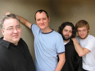 Shane Bartell (center) and his voice burn bright, but bandmates Marcus Rice (left), Derek Morris, and Stephen Bres (right) have got his back – and his Jack.