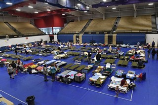 Evacuees at the Delco Center on Sunday