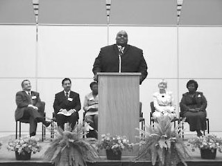 Austin ISD administrators and board members introduce newly appointed master principal Marcus Nelson, who will assume supervision of the new Secondary School Blueprint Initiative covering Reagan and LBJ high schools and Dobie and Pearce middle schools. Seated (l-r) Superintendent Pat Forgione, board President Doyle Valdez, trustee Cheryl Bradley, elementary master principal Claudia Tousek, and Associate Superintendent Darlene Westbrook. See p.20.