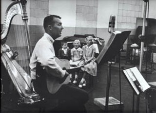 Tony, Eliza, and Nancy Gilkyson accompany their father, 
Terry, circa 1956.