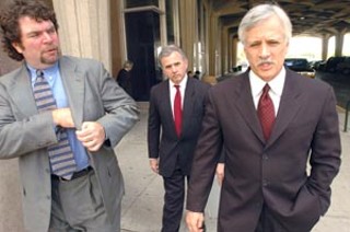 Gary Bradley (r) leaves bankruptcy court Tuesday with attorneys Eric Taube (l) and Ray Battaglia.