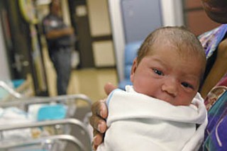 Baby Alexis Nicole Daffern awaits a visit in the prison hospital from her mom, Carla Daffern.