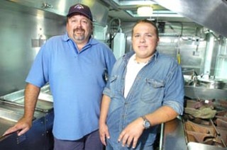 David Long (l) and Josh Morehead during a rare quiet moment in the Locations Catering trailer