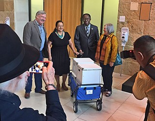 Fred Lewis, Susana Almanza, Nelson Linder, and Mary Ingle at City Hall in March with a reported 32,000 signatures on the petition to demand CodeNEXT be put to a public vote