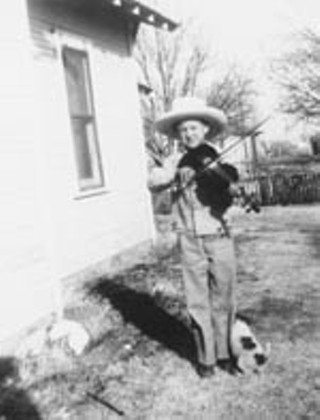 This was taken in about 1947 outside our house in Meadow. All hat and no cattle, as they say in Texas. But I did have a dog. Looks like he's looking for a place to relieve himself. My fiddlin' had that effect on animals.