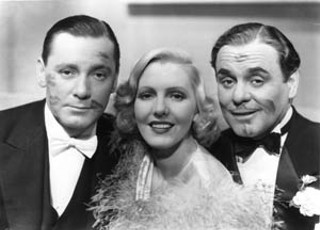 If you could only kiss: Arthur's lipstick traces on Herbert Marshall (l) and Leo Carrillo, 1935