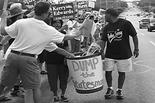 Austinites lined the Congress Avenue bridge Sunday to protest the <i>Statesman</i>'s endorsement of Bush.