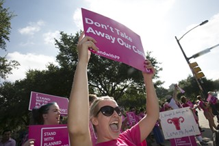Pro-choice advocates rally against state attacks on Planned Parenthood in 2015.
