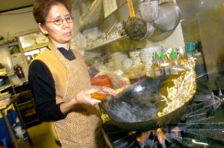 Tran Ngoc working in the kitchen