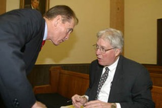 Attorney Terry Scarborough confers with defense
witness Jim Bopp, an Indiana lawyer who specializes
in campaign finance laws.