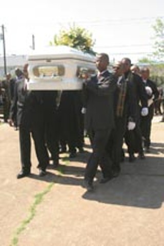Dorothy Turner's casket is carried into the services.