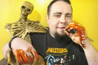 Marvin Day takes a smoke break between filleting hookers and building full-body prosthetics
