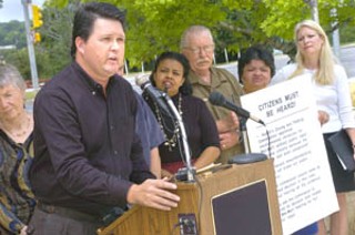 At a press conference Monday at City Hall plaza, a coalition of community, labor, and environmental leaders came together to protest the city's handling of a new 203,000-square-foot Wal-Mart Supercenter planned for FM 620 near the Four Points area. They launched a new campaign for asking for changes to city code with respect to big-box development, including increased notice for area residents closest to the development as well as a mandatory impact analysis to determine if the big-box business poses economic or environmental costs to the community. Outcry began after the city's Zoning and Platting Commission granted Wal-Mart an environmental variance, which neighbors say was done without input from opponents of the project, who believed the variance hearing had been postponed. The commission agreed Tuesday evening, rescinding their initial approval, but after hearing testimony from opponents after midnight, the commission voted to amend the evening's earlier motion, reverting back to their original May 3 decision to approve Wal-Mart's environmental variance. <i> – Dan Mottola</i>