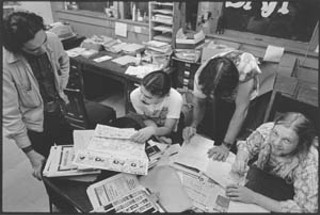 Precomputer Age: Richard Croxdale (far right) and fellow 
young activists lay out <i>The Rag</i> old-school style.