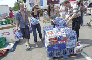 Austinites turned out in droves to help with Hurricane
Katrina relief. At Hancock Center, dozens, possibly
hundreds, of citizens went into the HEB, purchased
bottled water, diapers, and other needed items, and took
them straight to waiting trucks, where volunteers – some
from nearby businesses on their lunch breaks – helped
sort and load them. HEB and numerous other Austin
businesses also donated large amounts of cash and
supplies. Approximately 4,000 Katrina evacuees are now
calling Austin home, some permanently. For more
Katrina coverage, see <a href=http://
www.austinchronicle.com/issues/dispatch/2005-09-09/
pols_feature.html><b>Home From Home</b></a>.