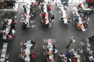 The Red Cross consults with evacuees at the convention center.