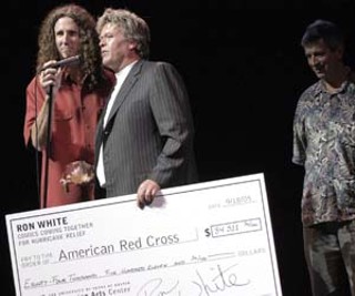 Austin comic John O'Connell steadies the mic for Ron
Tater Salad White as he talks about the big money
raised for the Red Cross at last Sunday's Comics Coming
Together for Hurricane Relief at Bass Concert Hall.