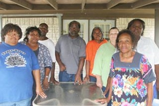A group of Edna's east-side residents – including
Jean and Olin Robinson, second and fourth from left – say
they're tired of DA Bobby Bell's lopsided brand of justice.