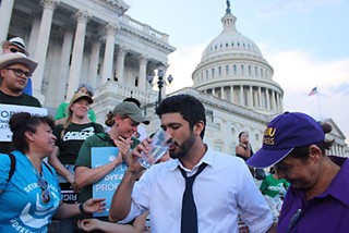 Rep. Greg Casar takes his first sip of water after an eight-hour thirst strike