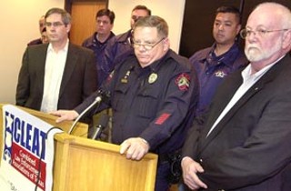 Austin Police Association President Mike Sheffield (at lectern) filed a grievance against the city for the leak of the Citizen Review Panel decision in the Schroeder/Rocha case.