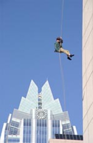 Central Texas Mountaineer rappelling down the Radisson Hotel