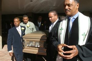 Austin civil rights and Democratic Party activist Hazel
Falke-Obey was laid to rest Friday afternoon, following a
memorial service at First Baptist Church downtown,
attended by hundreds of relatives and friends and
closing with a eulogy by the Rev. Jesse Jackson (right).
Obey was a key figure in integrating the Austin
Independent School District, speaking out on police
treatment of minorities, and other issues. Numerous
current and former elected officials from around Texas
and the nation attended her funeral. See <a href=http://www.austinchronicle.com/pols_feature6.html><b>Remembering Hazel Obey</b></a>.
