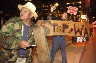 While President Bush commented on the state of the union last night, a few hundred protesters organized as World Can't Wait met in front of City Hall to make their own commentary. They banged on drums and on anything else available and said their goal was to drown out the lies.