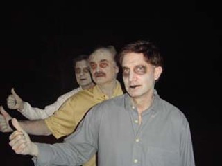 Mayor Will Wynn (front) and former mayors Jeff Friedman
and Bruce Todd became zombies on Sunday. (Sorry, the
jokes here are just so easy it's not worth it.) The
occasion was the filming of a scene for <i>Z: A Zombie
Musical</i>, the first zombie musical feature film,
according to a press release. Shooting is expected to
continue through April 2006, and the film will contain
other local luminaries and politicians, including another
former mayor, Kirk Watson. (See Film News for more)