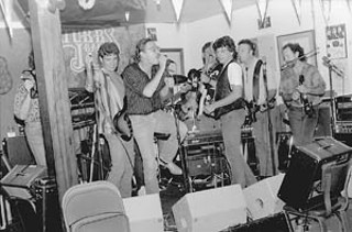 Some Kind of Lubbock Jam (l-r): A Maines brother, Terry Allen, Lloyd Maines, Joe Ely, Jesse Taylor, and Richard Bowden at Stubb's BBQ, 1988