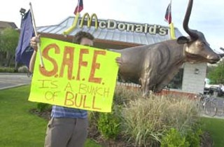 Activists with the Student/Farmworker Alliance converged on the UT-area McDonald's last Friday to mark the birthday of the late farmworker union leader Cesar Chavez and to demand better treatment and pay for the farmworkers who supply McDonald's with produce. A similar, three-year protest against Taco Bell in recent years helped win an agreement from that company to improve farmworker conditions.