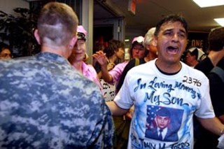 Juan Torres, father of John M. Torres (killed in Afghanistan
July 12, 2004), confronts military recruiters at their Dobie
Mall offices on Monday. He joined Cindy Sheehan and the
anti-war group Code Pink in the rally.