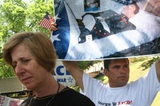 The nation's most prominent anti-war protester, Cindy
Sheehan, spoke on the University of Texas campus on
Monday. Behind Sheehan is Carlos Arrendas, holding a
photo of his son Juan Arrendas. Like Sheehan, Carlos
Arrendas lost his son in the Iraq war.