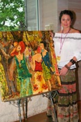 Kathy Womack displays a painting she created especially for Umlauf's annual auction.