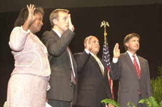 Austin swore in its new City Council on Tuesday at the 
Palmer Events Center: from left, Sheryl Cole (Place 6, 
replacing retiring Mayor Pro Tem Danny Thomas), 
Brewster McCracken (Place 5, incumbent), Mike Martinez 
(Place 2, replacing retiring Raul Alvarez), and Will Wynn 
(mayor, incumbent). The new council's first meeting is 
today (Thursday).