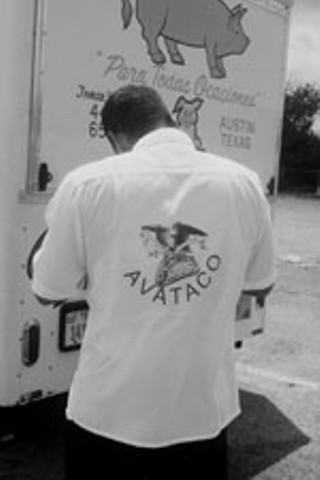 Polo Cadena inspects a taco stand during AVATACO’s citywide census drive.