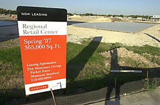 Starting the engines: At I-35 below 51st Street, a Regional
Retail Center is already being leased and built; the sales-
tax revenues it generates will help pay for Mueller
infrastructure.