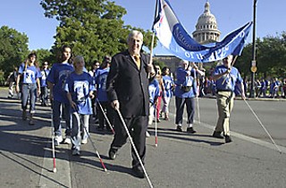 Blind and visually impaired Central Texans marched from the state Capitol to Austin City Hall last Wednesday to mark White Cane Day, a celebration of laws ensuring equal access to public facilities. The observance originally began in 1964 as White Cane Safety Day under President Lyndon Johnson to promote courtesy and special consideration for the blind, but has since come to have greater meaning: The white cane is a symbol of independence, says Gloria Bennett of the Texas School for the Blind and Visually Impaired. For those who use it, it symbolizes independent mobility and self-sufficiency. For those who see it, it symbolizes human dignity and the power of independence.