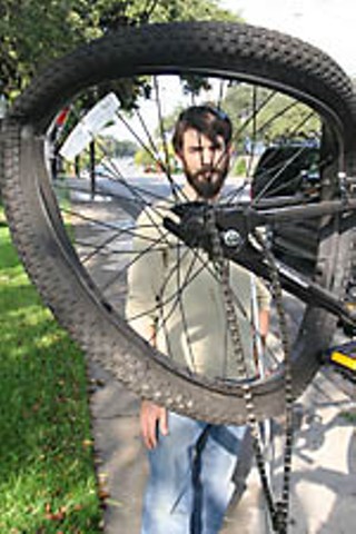 Casey Wink Miller and the bike he was riding when he was hit by a motorist from behind