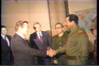 Rumsfeld with his pal Saddam in 1983