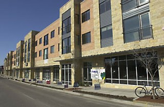 Storefronts open directly onto wide sidewalks as at the new VMU-like project at 3130 Guadalupe