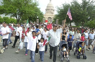 Immigrants and supporters pour out of the Capitol's front gates onto Congress Avenue during Tuesday's National Day of Action for Immigrant Rights rally and march.