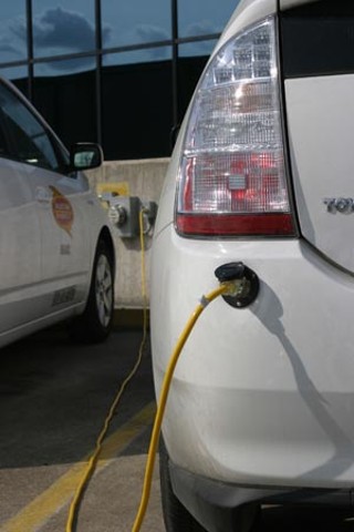 An electric hybrid plug-in car charges up (or puts power back into the grid) via a wall socket. Sacramento's municipal utility has done similar Prius conversions, which after six months of testing, are averaging between 100 and 125 miles per gallon.<br>
Photo courtesy of Austin Energy