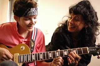 Rosie Flores (r) instructs Katie in the art of the twang.