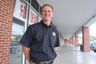 Ron Kowal of Austin Affordable Housing Corp. at the agency's Eastland Plaza, which helps fuel the nonprofit's affordable-housing endeavors.