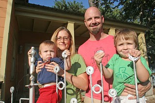 Jennifer Chenoweth and Todd Campbell, shown with kids Roland and Wallace, at their East Austin home