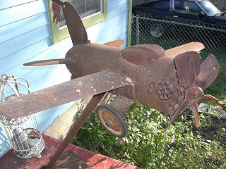 A thief swiped this iron statue of an airplane, which had functioned as an eye-catching mailbox<br>Photo provided by Todd Campbell