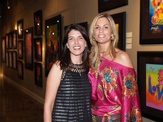 Lisa Russell (l), owner of the Russell Collection Fine Art Gallery, and “Best of Austin” award-winning event planner Suzanne Court at Russell’s Peter Max exhibition