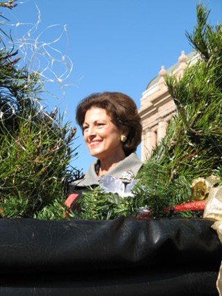 Christmas arrived at the state Legislature for Nadine Craddick, wife of House Speaker Tom Craddick, and it was pulled by a Clydesdale named Sidney. Three Virginia pines were delivered by horse-drawn carriage to the Capitol on Monday morning, where they were received by Craddick and Secretary of State Phil Wilson. (The speaker himself was off to one side, taking photos of his wife.) One tree went to the lieutenant governor's reception room, one to the governor's office, and the third, the Angel Tree, stands in the Capitol underground extension carrying gift tags. Each names a Christmas-wish present from 115 foster children currently in state care. Capitol staff and visitors are invited to take a tag, buy a present, and deliver it to the speaker's office before 10am on Dec. 10. We can make sure that each of these children has a very special Christmas, said Craddick. 	<i>– Richard Whittaker</i>