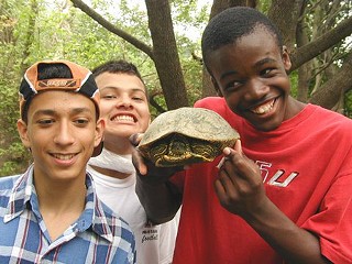Hands-on Learning: At preserves, kids can get turned on to the natural sciences and a strong feeling for the natural world. Austin Youth River Watch, an afterschool mentoring program primarily for East Austin students, engages kids in testing water quality and befriending wildlife.<br>Photo courtesy of the Trust for Public Land